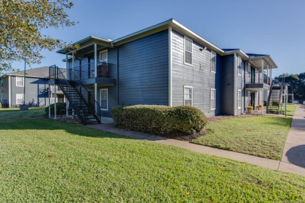 Exterior entrance of University Trails Prairie View: Beautiful, fully-furnished housing units